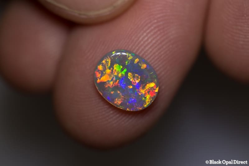 1.38 ct orange green crystal opal 10x8x2mm
