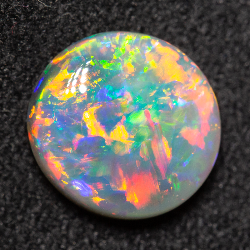 1.38 ct dark opal 8.4x7.9x3.4mm