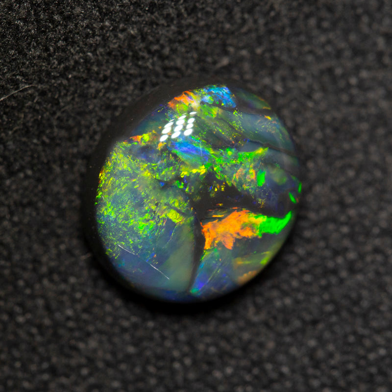 1.54 ct black opal 8.5x7.6x3.7mm
