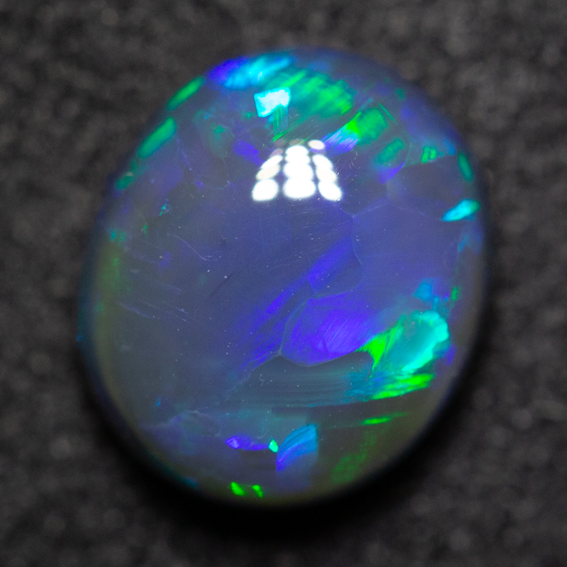1.54 ct black opal 8x6.9x4.2mm