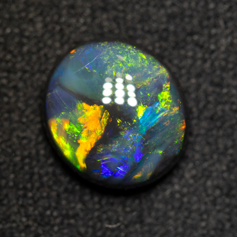 1.54 ct black opal 8.5x7.6x3.7mm