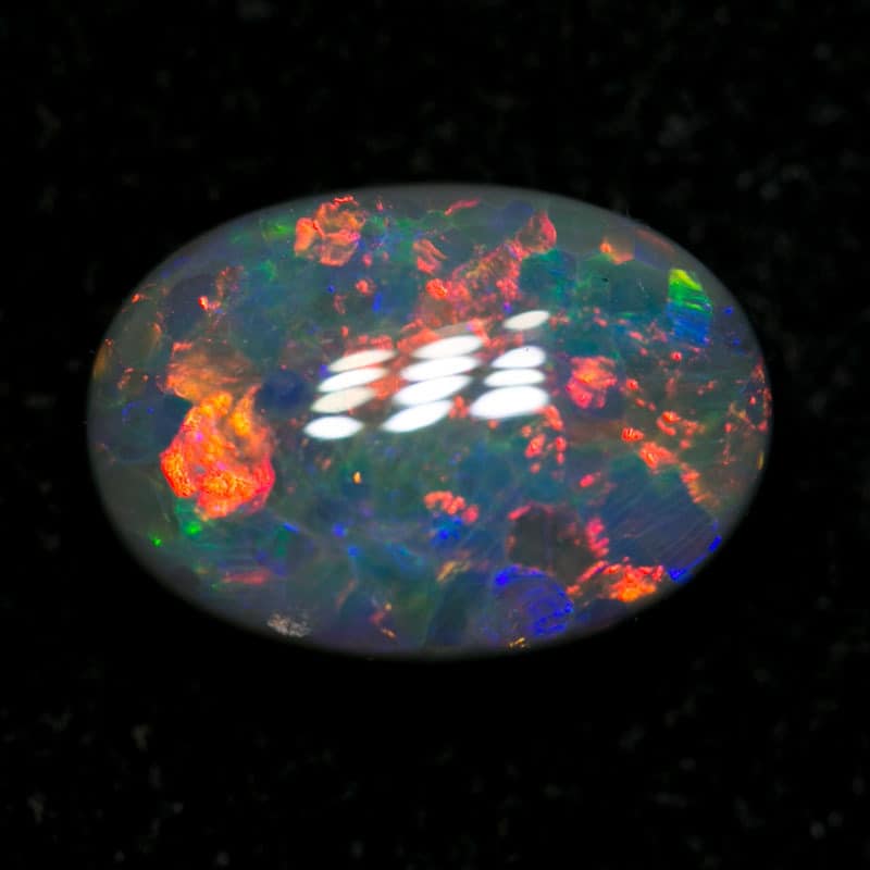 1.60 ct dark opal 9x7x3.5mm