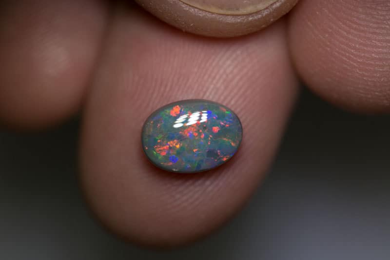 1.60 ct dark opal 9x7x3.5mm