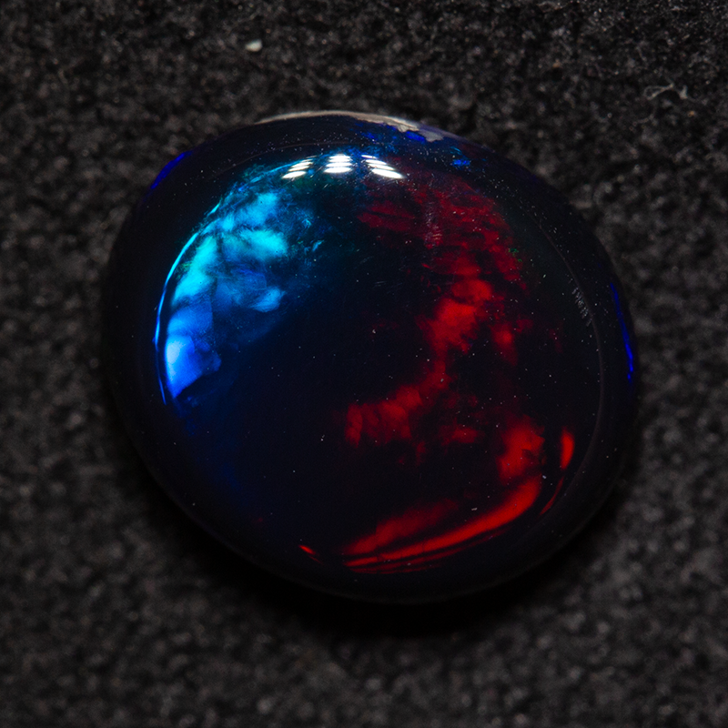 1.71 ct black opal 9x7.8x3.6mm