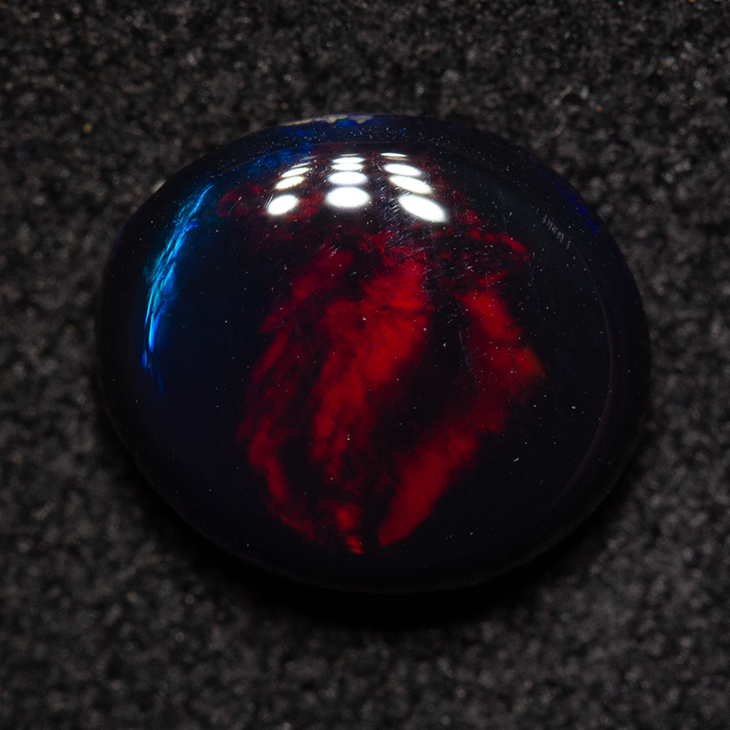 1.71 ct black opal 9x7.8x3.6mm