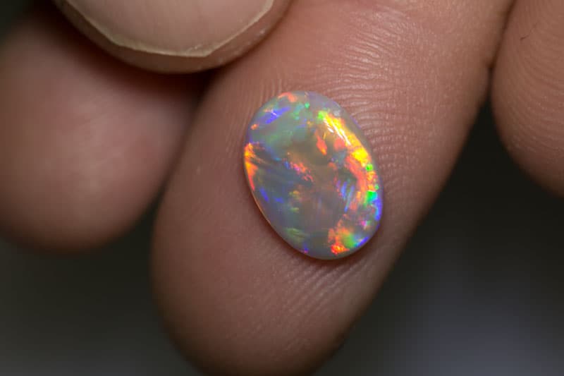 1.79 ct dark opal 11.5x8.5x2.5mm
