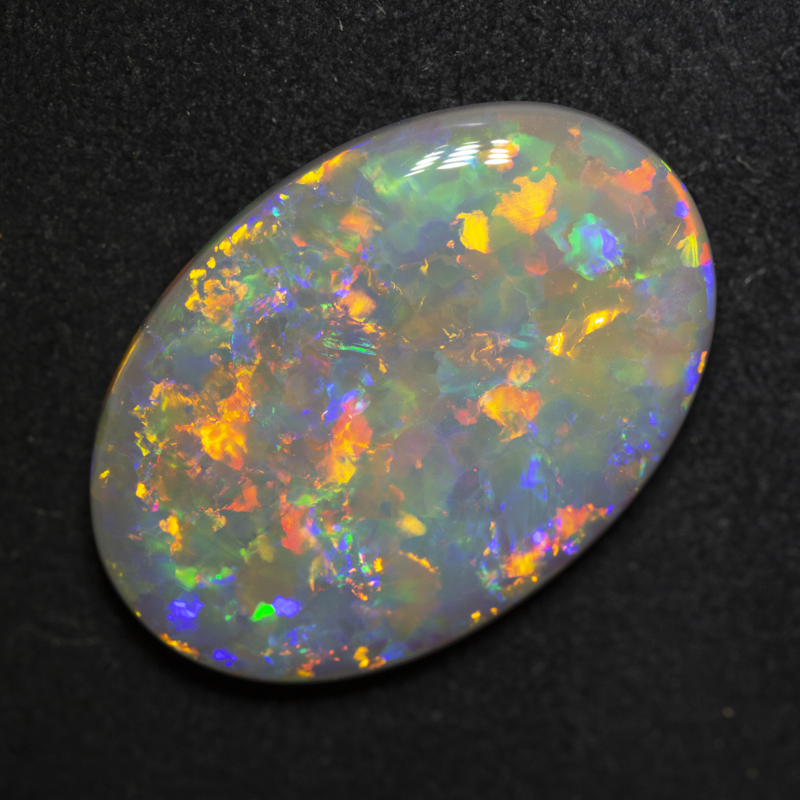 10.14 ct dark opal 22.4x15.6x4.4mm