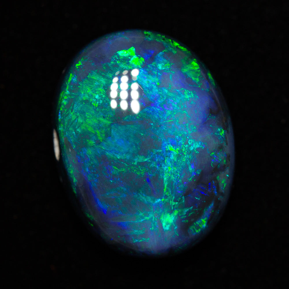 10.30 ct black opal 16.5x12.9x7.6mm