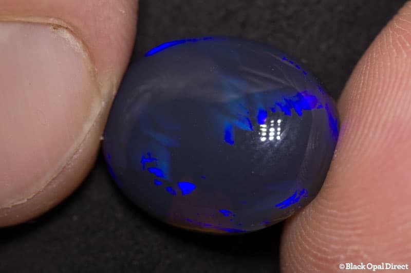 10.43 ct black opal 16x13x7.5mm