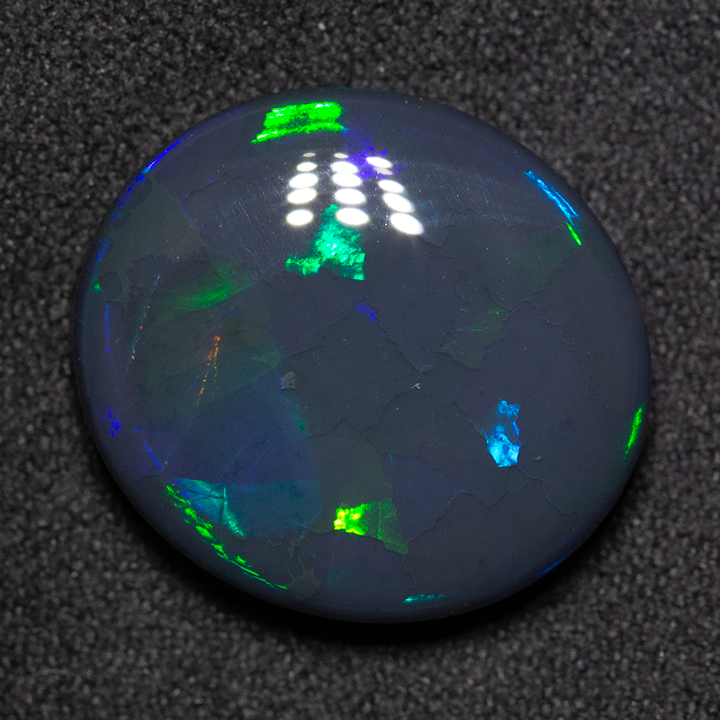12.01 ct black opal 18x16.2x6.4mm