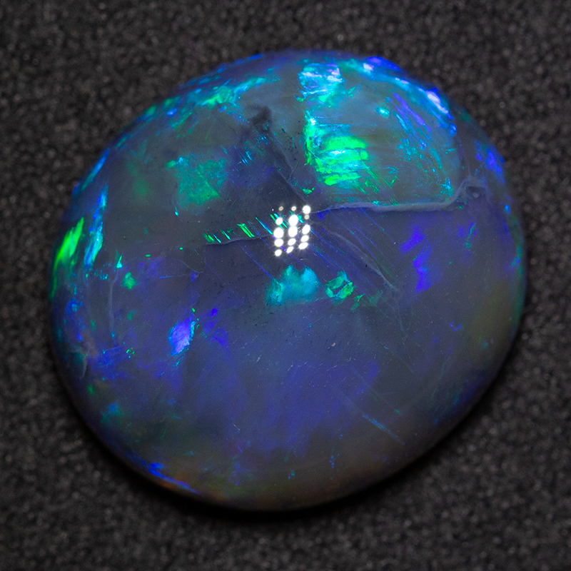 14.98 ct black opal 18.1x16.3x8.9mm