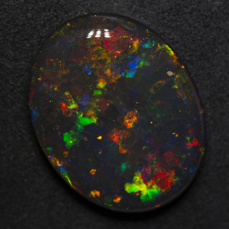 15.83 ct gem black opal 22.2x17.5x6.3mm