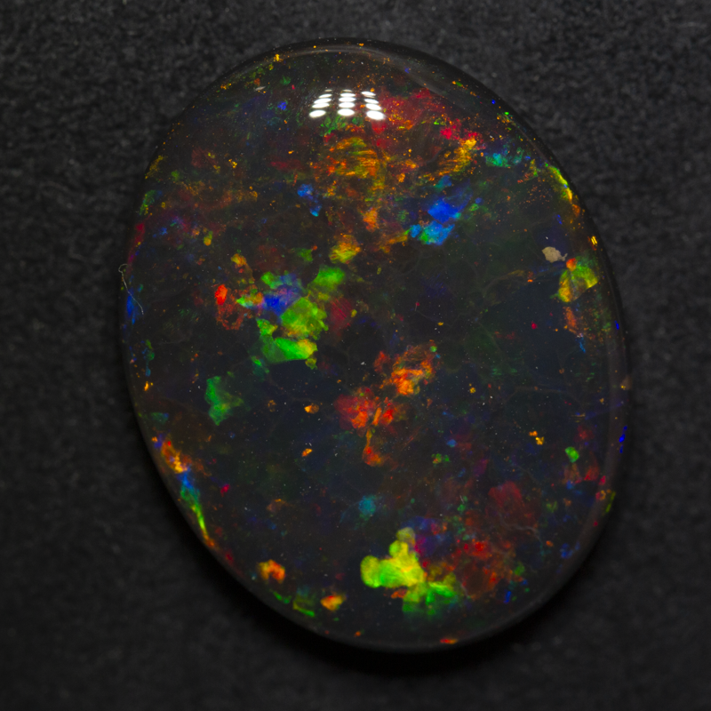 15.83 ct gem black opal 22.2x17.5x6.3mm