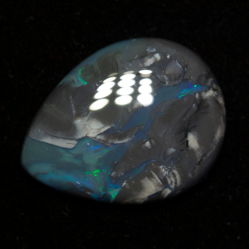 16.28 ct black opal 23.6x18.3x5.7mm