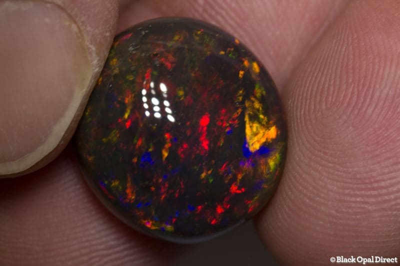 18.56 ct gem black opal 18x17x10mm