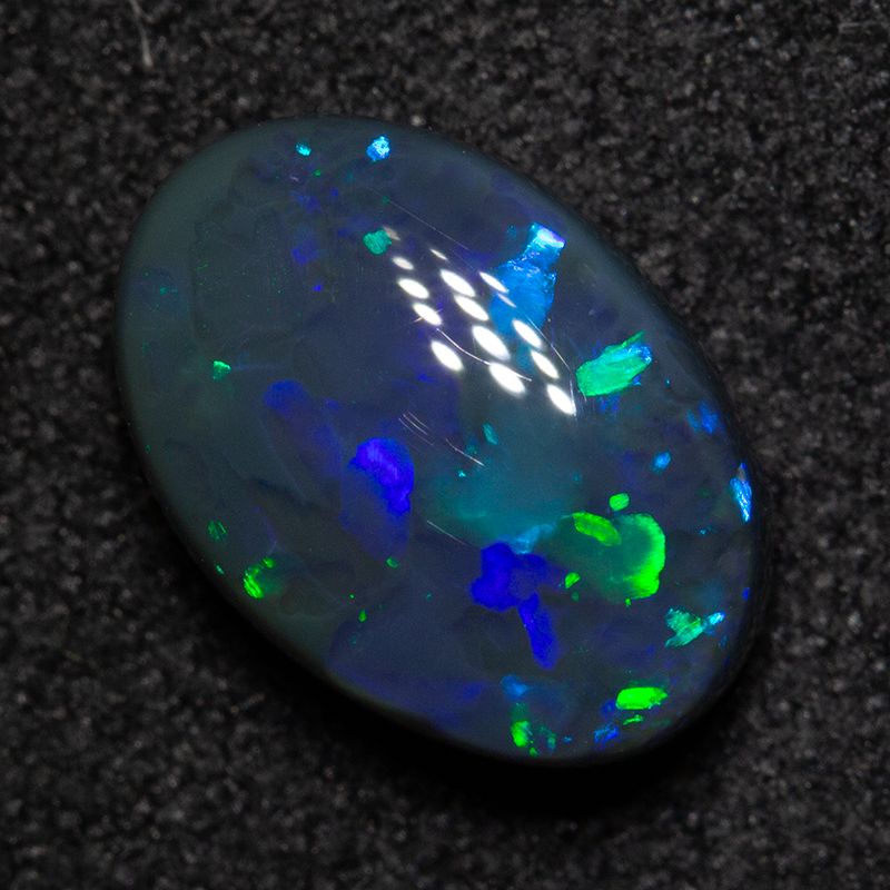 2.08 ct double-sided black opal 10.3x7.3x4.3mm