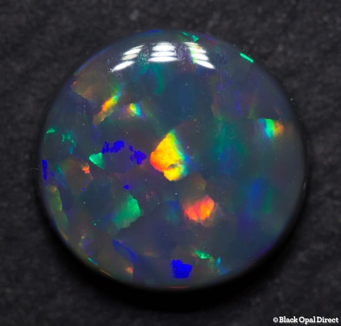 2.08 ct Harlequin black opal 9.5mm round x3mm