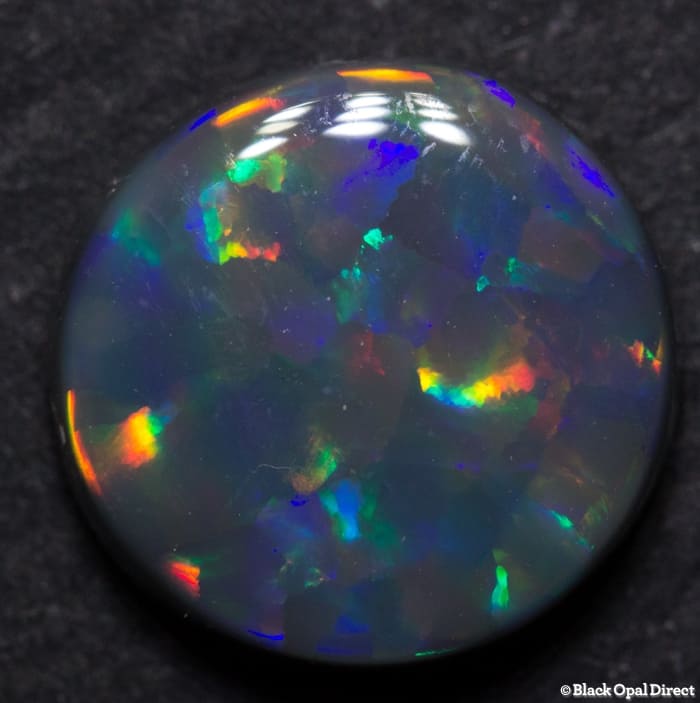 2.08 ct Harlequin black opal 9.5mm round x3mm