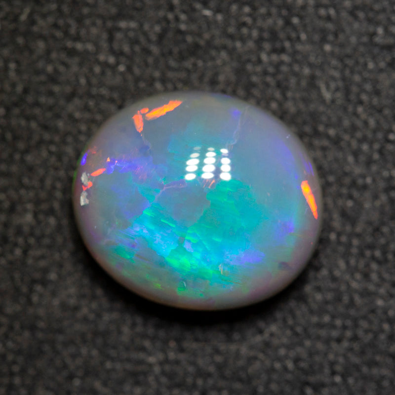 2.33 ct dark opal 9.5x8.3x4.9mm