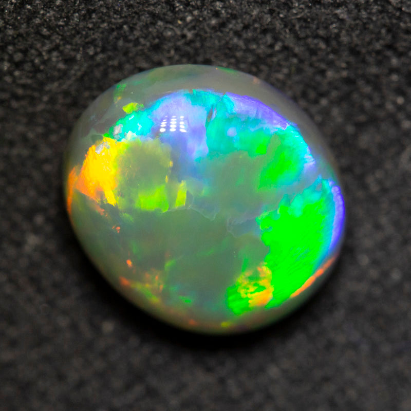 2.33 ct dark opal 9.5x8.3x4.9mm