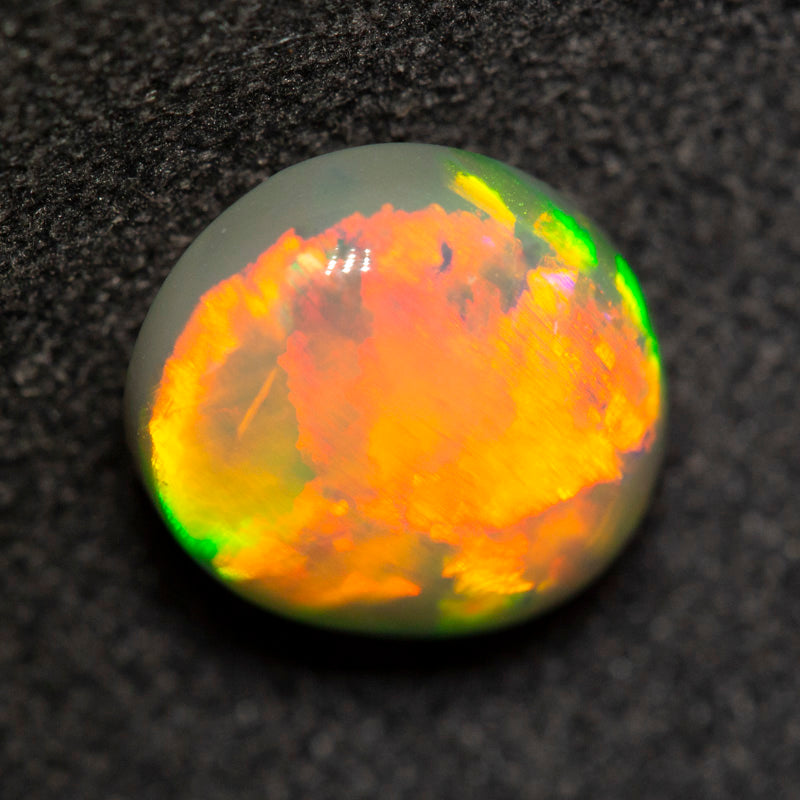 2.33 ct dark opal 9.5x8.3x4.9mm