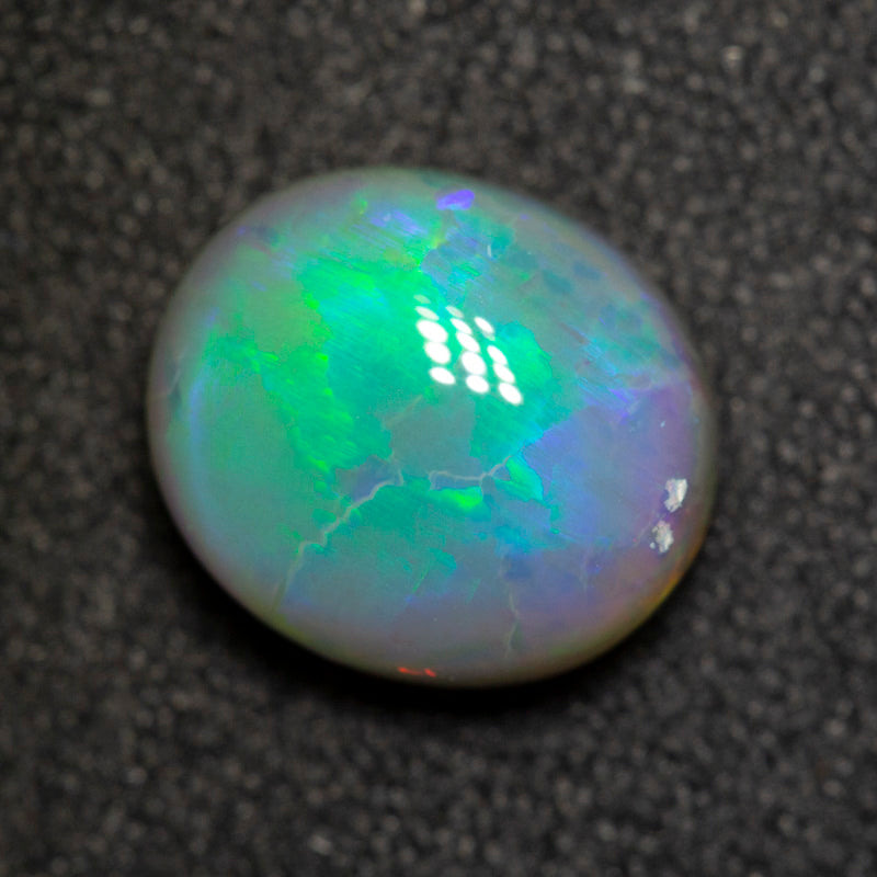 2.33 ct dark opal 9.5x8.3x4.9mm