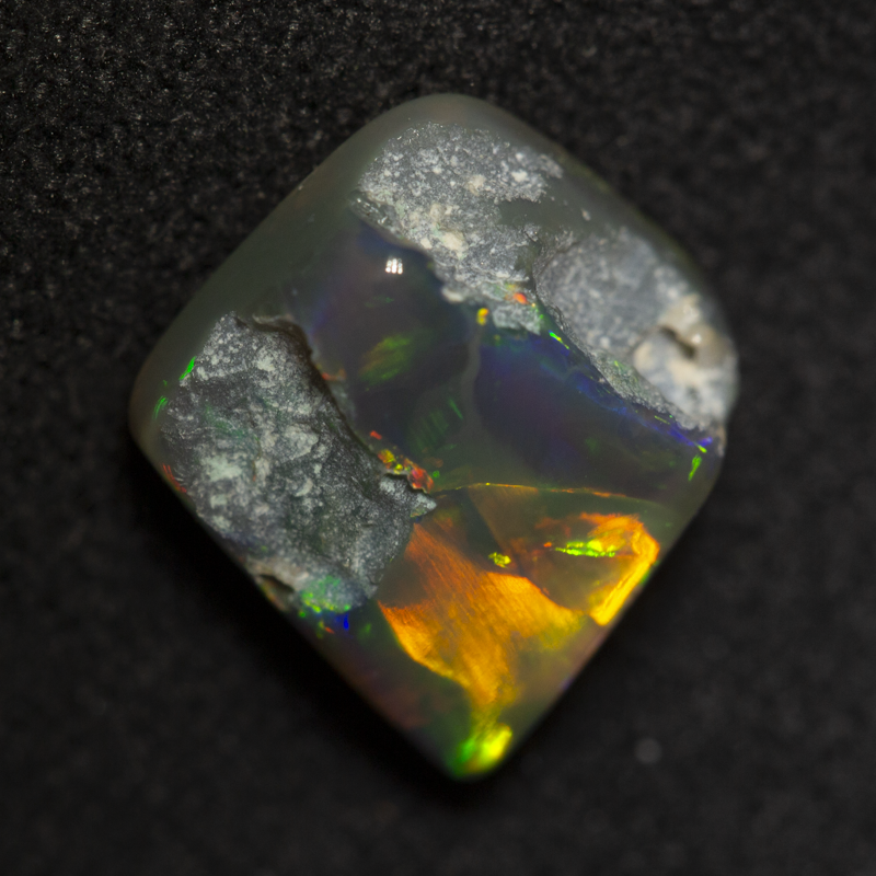 2.39 ct black opal carving 8.9x8.8x4.6mm