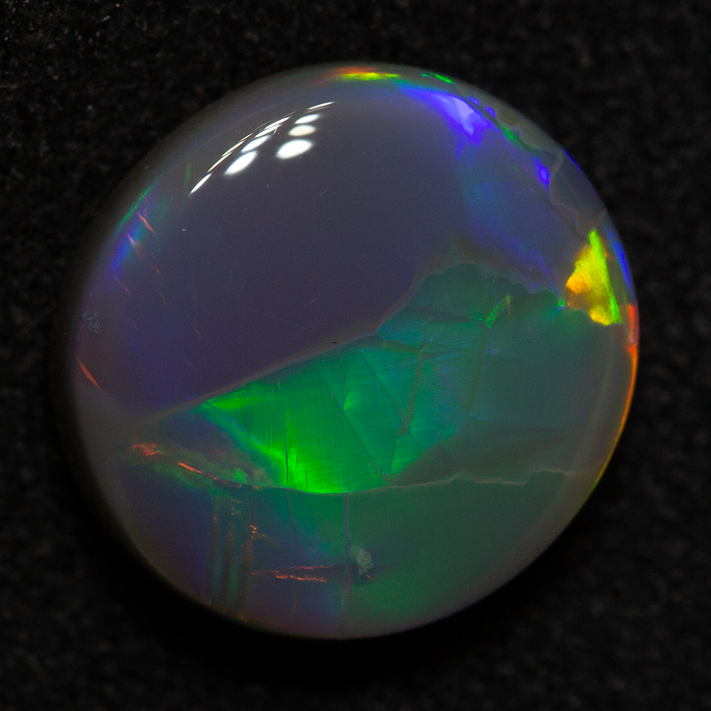 2.44 ct dark opal 9.8x9.3x4.1mm