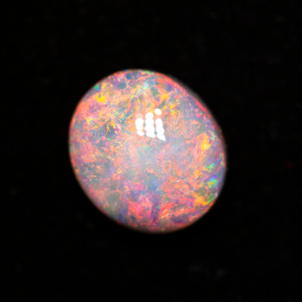 2.72 ct dark opal 9.7x8.6x5.4mm