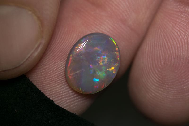 2.72 ct dark opal 12x10x3mm