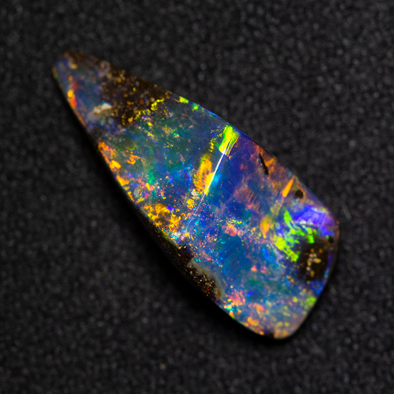 2.83 ct boulder opal 14.4x6.2x5.1mm