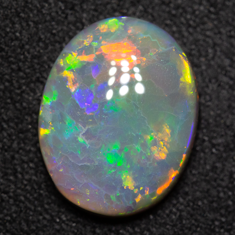 2.87 ct dark opal 11.6x9.2x4.2mm