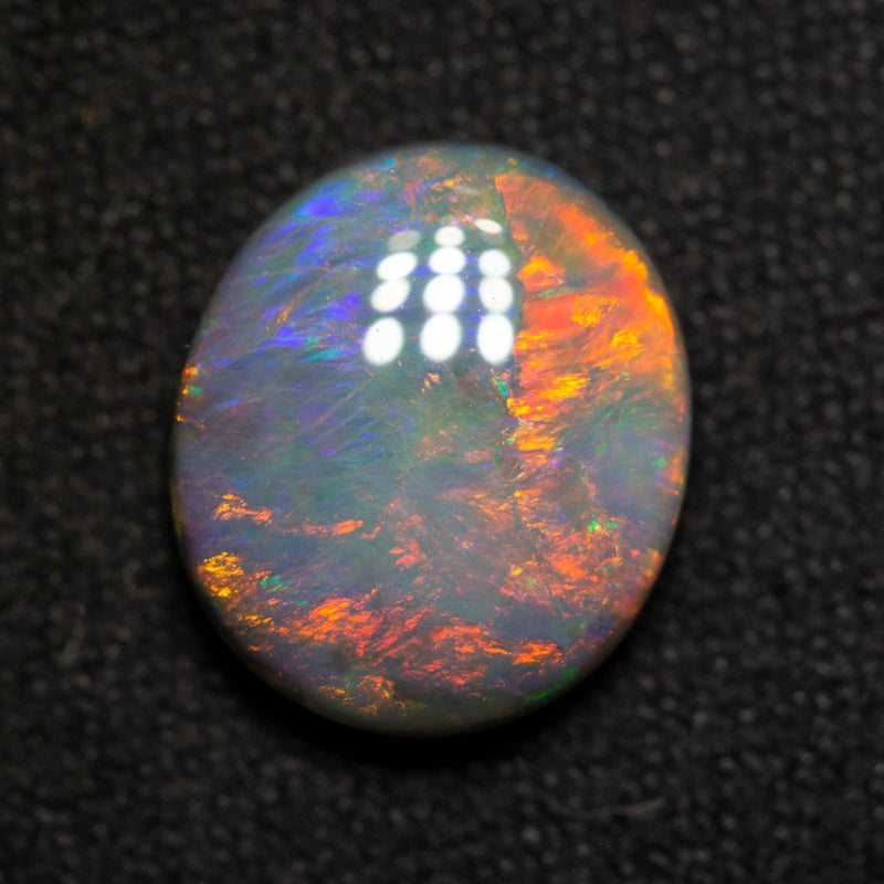 2.89 ct dark opal 10.8x9.2x4mm