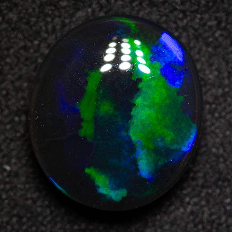 2.94 ct black opal 10.7x9.5x4.6mm