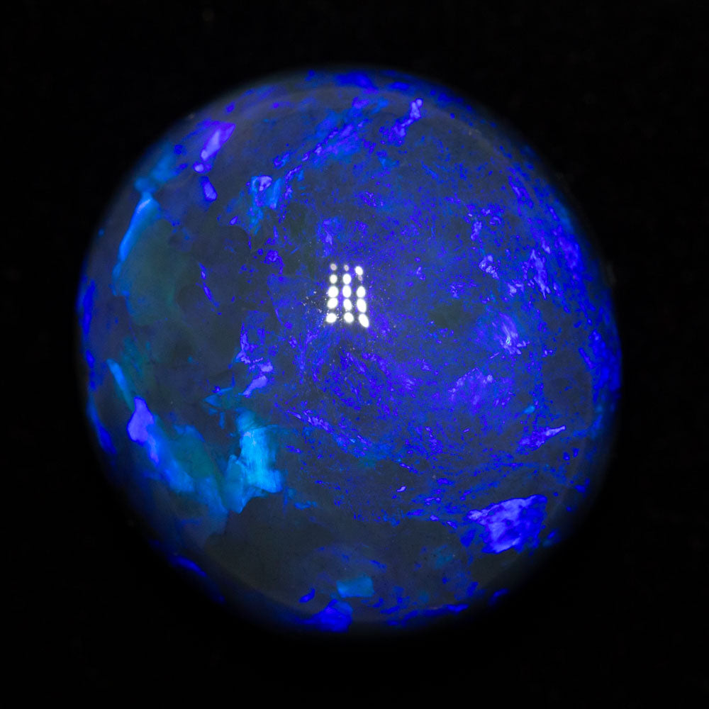 20.41 ct black opal 18.4x16.9x11.4mm