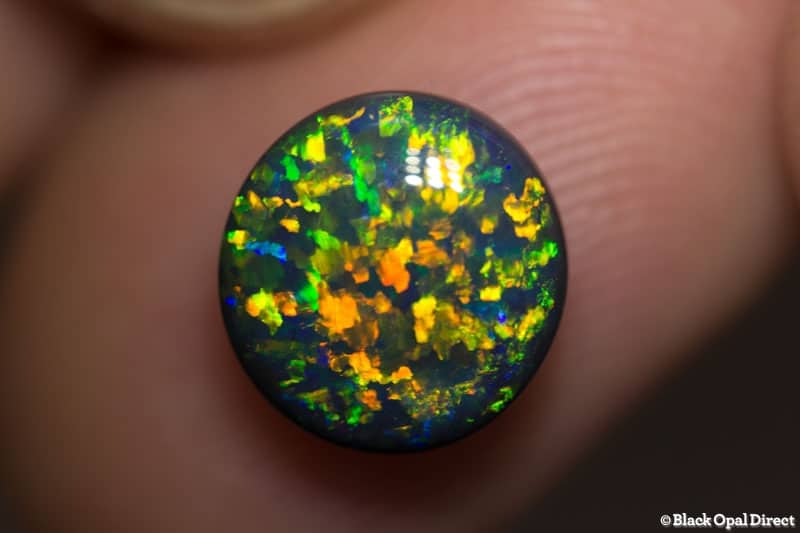 3.16 ct 10mm round black opal x 5mm thick