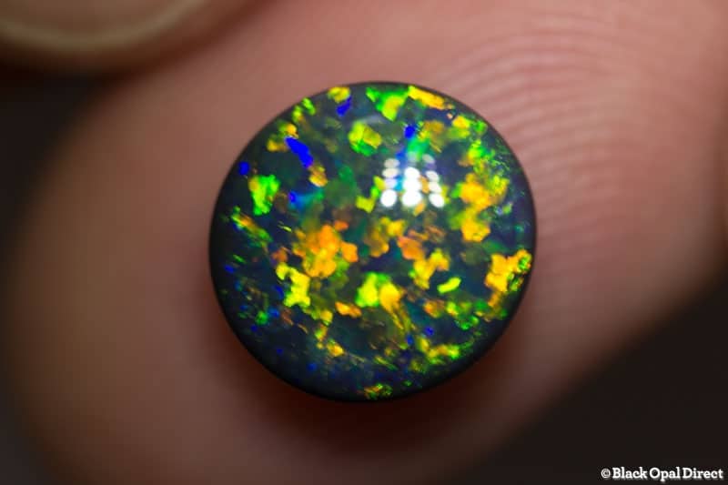 3.16 ct 10mm round black opal x 5mm thick
