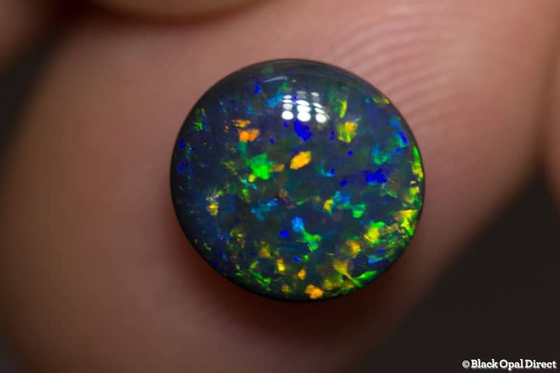3.16 ct 10mm round black opal x 5mm thick
