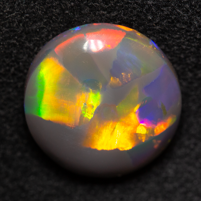 3.63 ct double-sided black opal 11.6x10.8x4.6mm