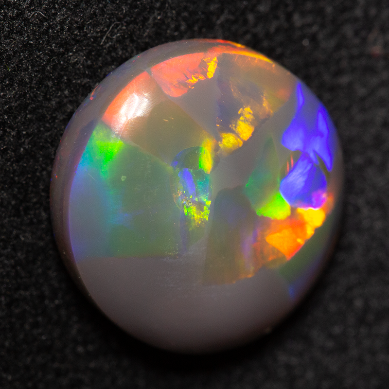 3.63 ct double-sided black opal 11.6x10.8x4.6mm
