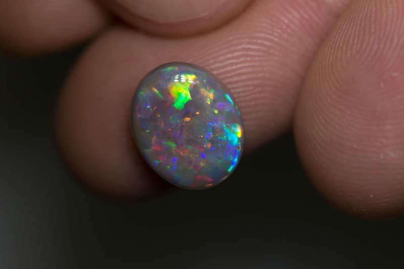 3.68 ct dark opal 12x10x4.5mm