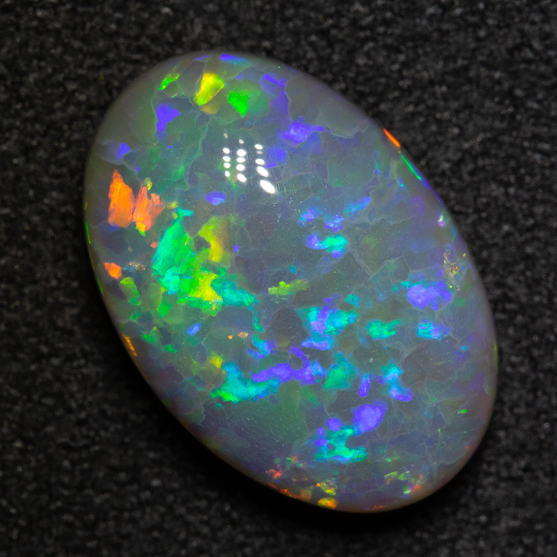 3.76 ct dark opal 13.6x9.3x4.8mm