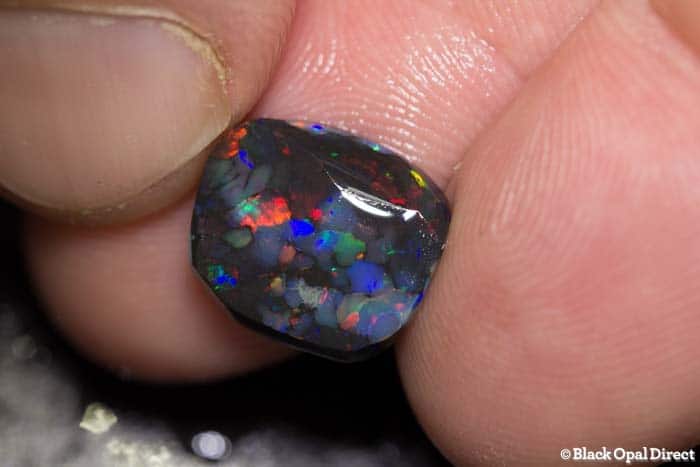 3.76 ct black opal rub 13mm across