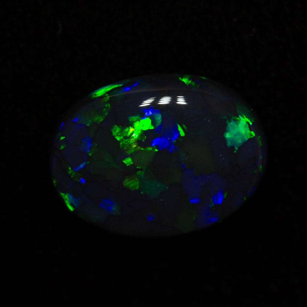 3.84 ct black opal 12.7x9.5x4.9mm