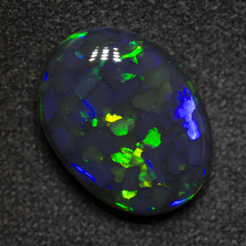 3.84 ct black opal 12.7x9.5x4.9mm