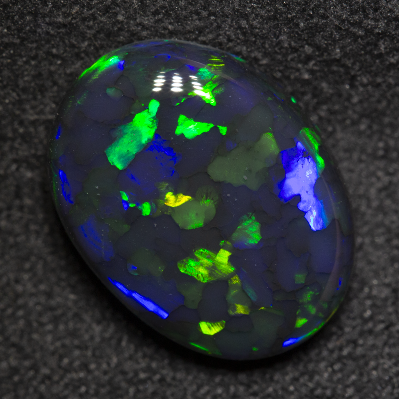 3.84 ct black opal 12.7x9.5x4.9mm