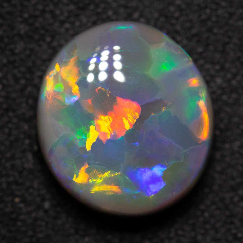 3.92 ct gem black opal 11.2x10.1x5.5mm