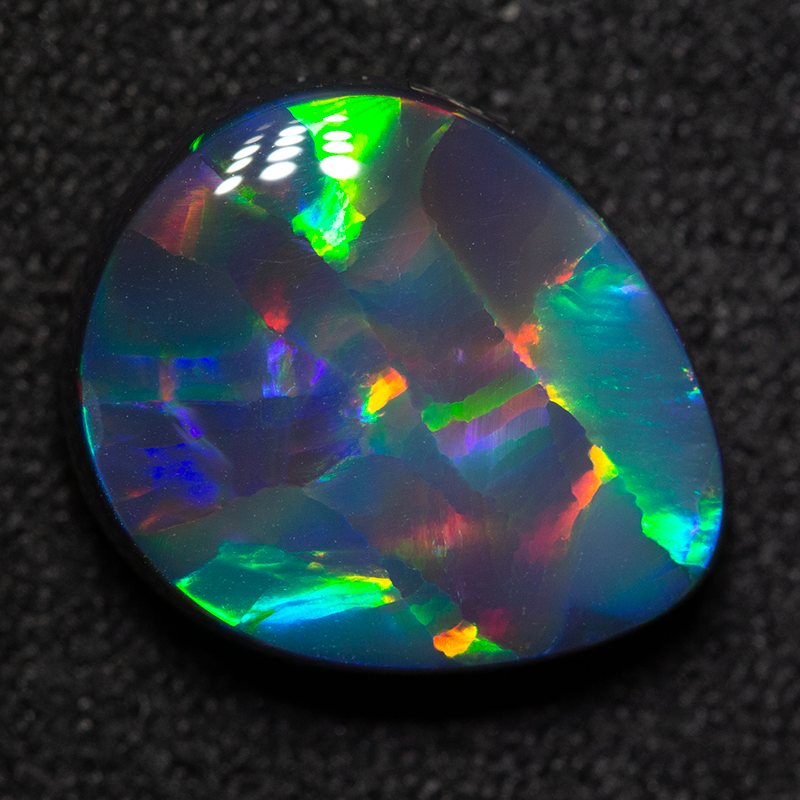 4.16 ct gem black opal 12.6x10.6x4.8mm