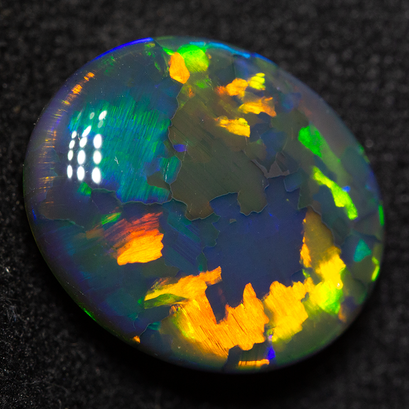 4.41 ct double sided gem black opal 12.2x10.4x5.7mm