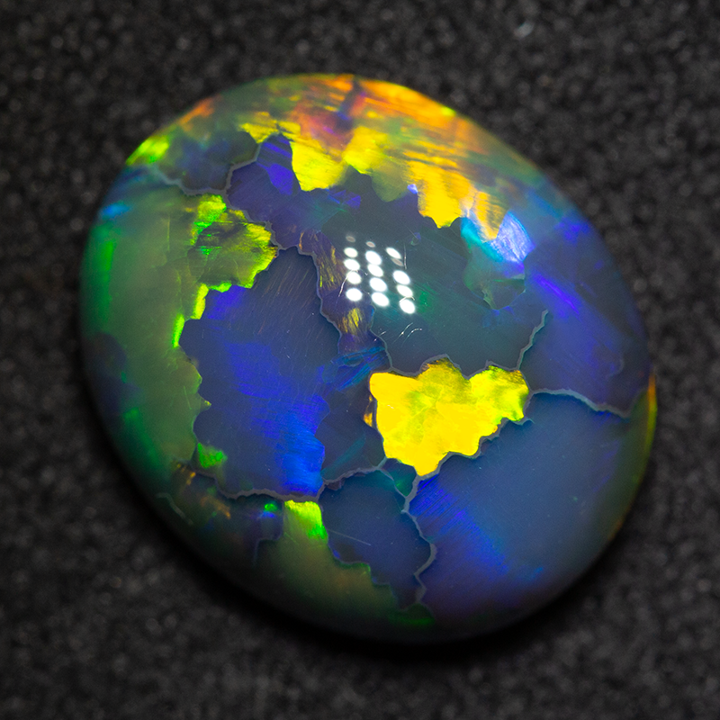 4.41 ct double sided gem black opal 12.2x10.4x5.7mm